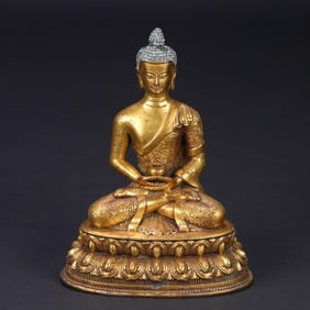 A Tibetan bronze gilt statue of Shakyamuni