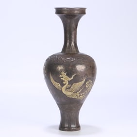 A Qing Dynasty sterling silver gilt phoenix pattern bottle