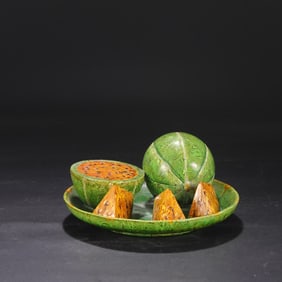 A Tang Dynasty yellow-green glazed twisted tire watermelon fruit plate