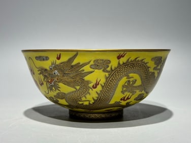 A Qing Dynasty Qianlong pastel yellow ground double dragon beaded bowl