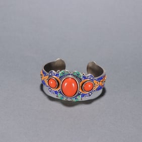 A Qing Dynasty silver-gilt baked blue inlaid southern red bracelet