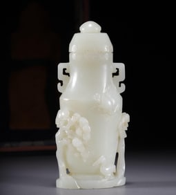 A Qing Dynasty Hetian jade pine crane pattern vase