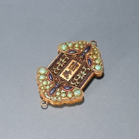 A Qing Dynasty silver-gilt filigree inlaid treasure fasting plaque