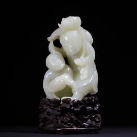A Qing Dynasty white jade and two immortal ornaments