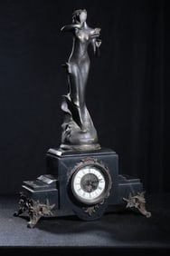 A 19th-century British Victorian bronze carved figure clock