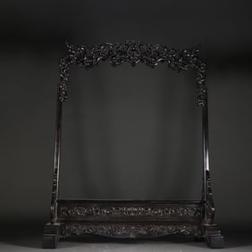 A Qing Dynasty rosewood dragon pattern pen hanging