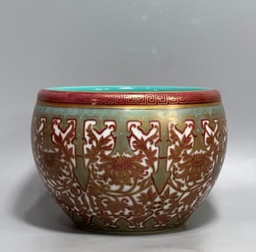 A Qing Dynasty Yongzheng year alum red gold brush wash