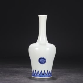 A Qing Dynasty Kangxi blue and white rattle statue