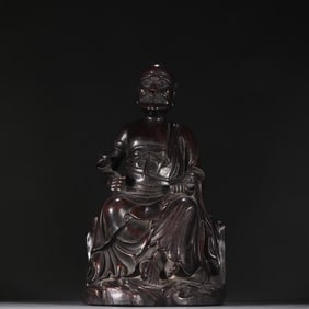 A statue of a rosewood Arhat