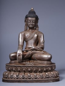 A seated statue of the Buddha in the Qing Dynasty with copper and gilt silver