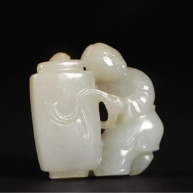 A Qing Dynasty Hetian jade boy holding a bottle