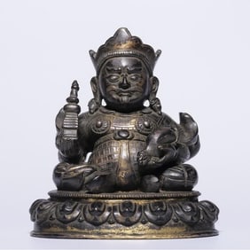 A seated statue of the Qing Dynasty copper gilt King of Duowen