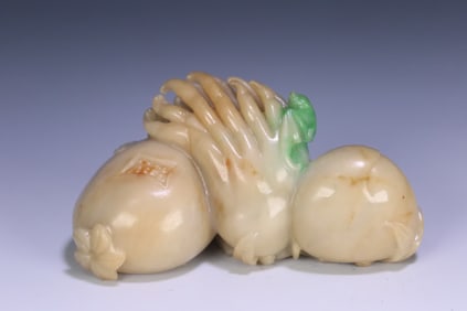 A Qing Dynasty jade ornament with three ornaments