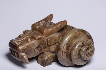 An ancient jade belt with a dragon in the ornament