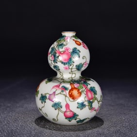 A Qing Dynasty Yongzheng pastel melon and a gourd bottle