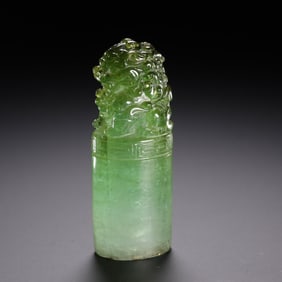 A Qing Dynasty tourmaline lion button seal