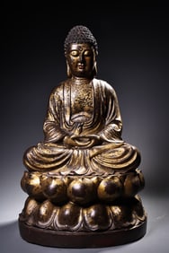 A Buddha statue carved with gold and clay