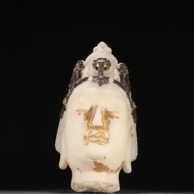 A Han Dynasty white jade gold-painted silver Buddha head