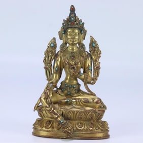 A seated statue of Tara, gilt and green in the Qing Dynasty