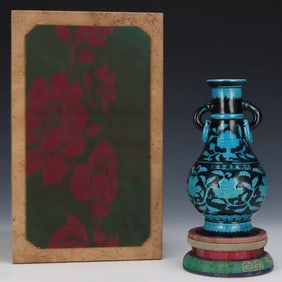 A Ming Xuande black ground peacock blue glaze entwined lotus pattern amphora