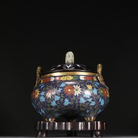 A Ming Dynasty copper-tired cloisonné entwined pattern three-legged aromatherapy stove