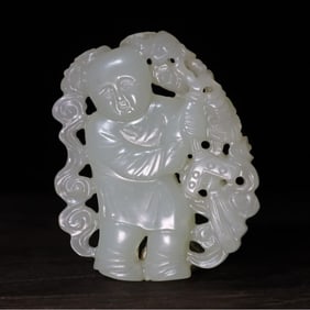 A Qing Dynasty jade carving boy holding a halberd and hanging a pendant