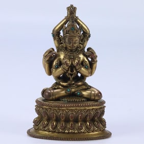 A seated statue of Guanyin with bronze gilt ten arms in the Qing Dynasty