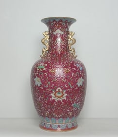 A Qing Dynasty Qianlong style foreign color carmine red rolled road pattern ground lotus support