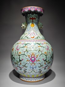 A Qing Dynasty Qianlong year holly glaze pastel passionflower pattern animal ear flip flask