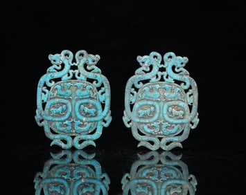 A pair of ancient turquoise carvings