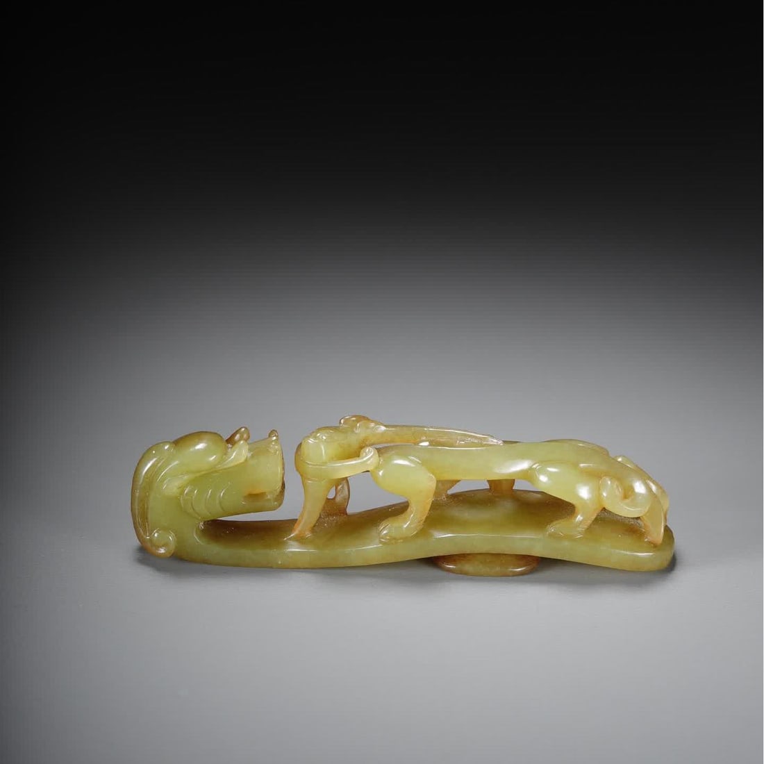 A piece of Qing Dynasty Hetian topaz dragon hook (1 of 9)