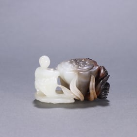 A Qing Dynasty Hetian jade seed material with a noble son carving