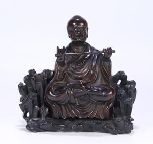 A Qing Dynasty rosewood arhat ornament