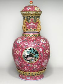 A piece made in the Qianlong period of the Qing Dynasty enamel color carmine red ground rolling road