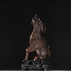 A Qing Dynasty boxwood dragon ornament
