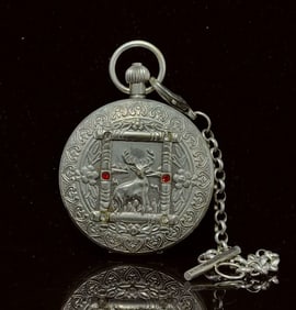 A double-open pocket watch of the sun, moon and stars