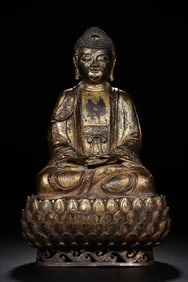 A seated statue of Shakyamuni Buddha in copper flowing gold in the Ming Dynasty (originally with