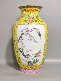 A Qing Dynasty Qianlong yellow ground flower and bird vase