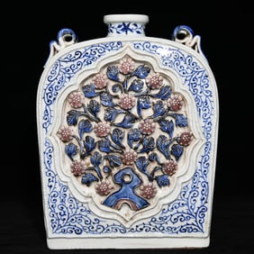 A Yuan blue and white glaze red pinched flower flat bottle