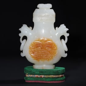 A Qing Dynasty Hetian white jade carved double phoenix ring appreciation bottle