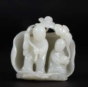 A Ming Dynasty Hetian jade seed material and two immortal ornaments