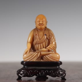 A Qing Dynasty Shang Jun Shoushan stone inlaid with many treasures Arhat statue