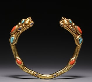 A Tang Dynasty pure gold inlaid coral turquoise double dragon bracelet