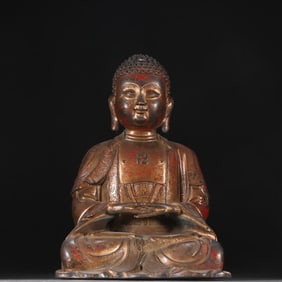 A statue of Shakyamuni in copper clay gold