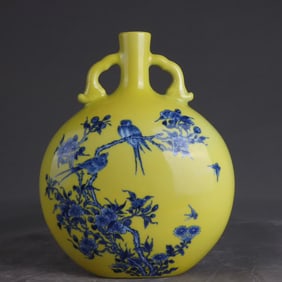 A Qing Yongzheng blue and white flower and bird moon vase with a yellow background