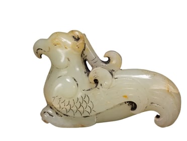A Qing Dynasty Hetian jade beast