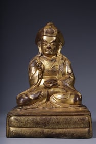 A seated statue of a bronze gilt peanut guru in the Qing Dynasty
