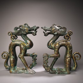 A pair of bronze rubbed gold belts with inscriptions squatting dragons