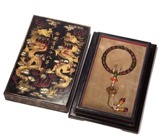 A piece of tourmaline from the Qing Dynasty held in hand