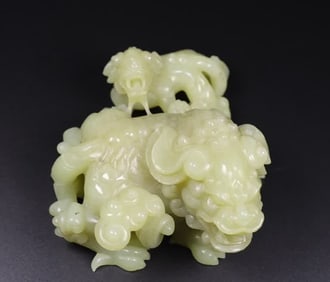 A Qing Dynasty Hetian jade lion